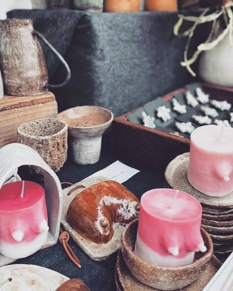 Market stall with pink candles and bowls