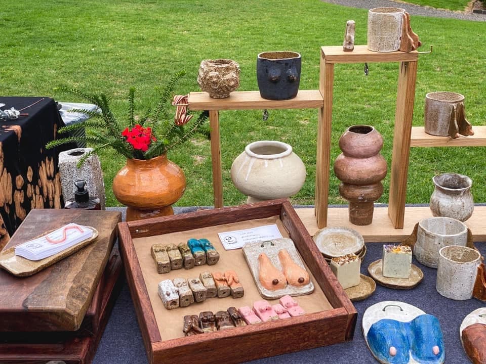 The Linh Ceramics market stall on the grass