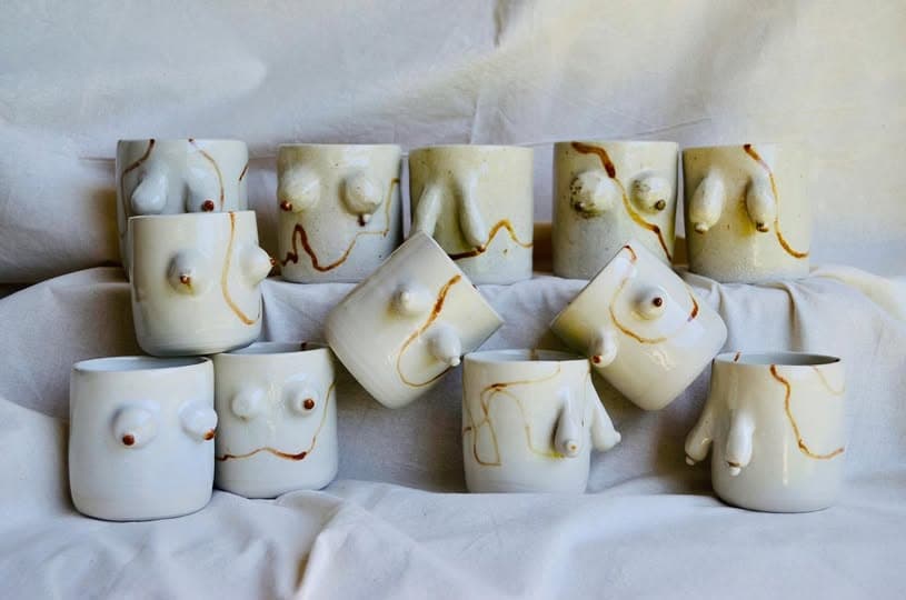 A group of cream cups with sculpted forms and iron lines